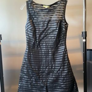 Black sleeveless dress. Falls above the knee on me (5’7)